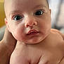 Emerson is registered to the contest to win money with this photo: baby, infant, face, skin, eyes, hand, closeup, portrait, expression, curious, soft_skin, newborn, child, human, person, indoor, blurred_background, cute, young, head