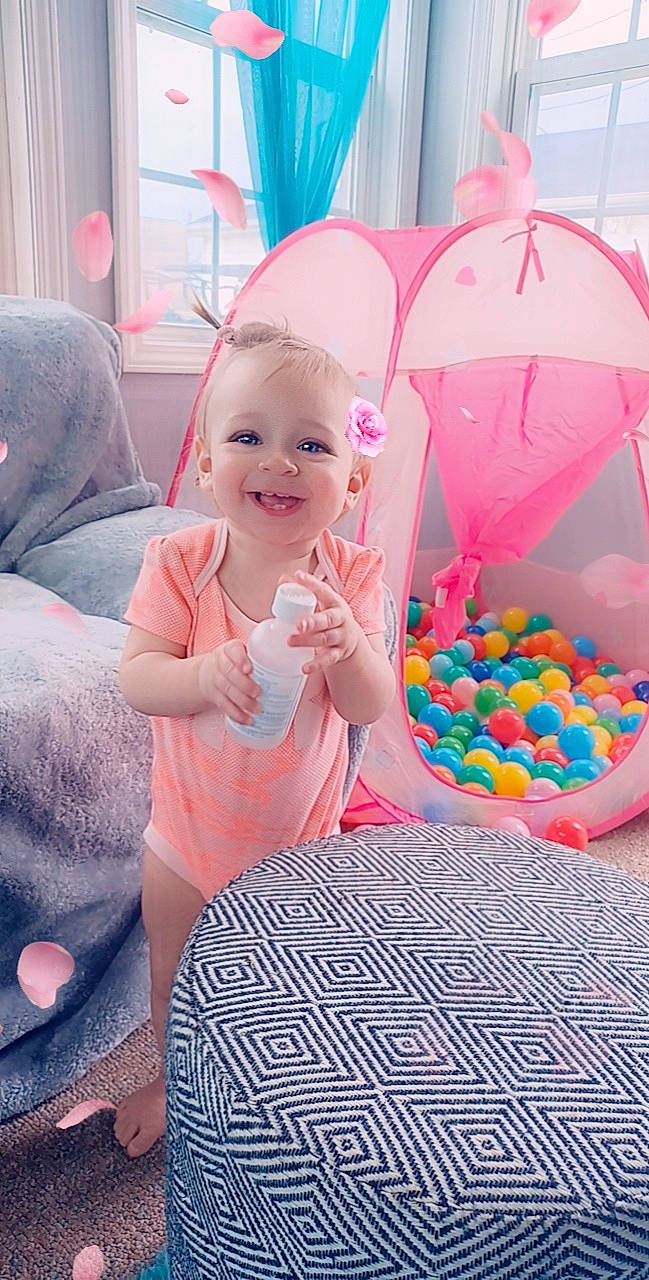 Allie Grace is registered to the contest to win money with this photo: baby, baby_products, baby_toddler_clothing, child, event, fun, happy, hat, joy, leisure, magenta, party_supply, person, pink, play, purple, recreation, shorts, smile, textile