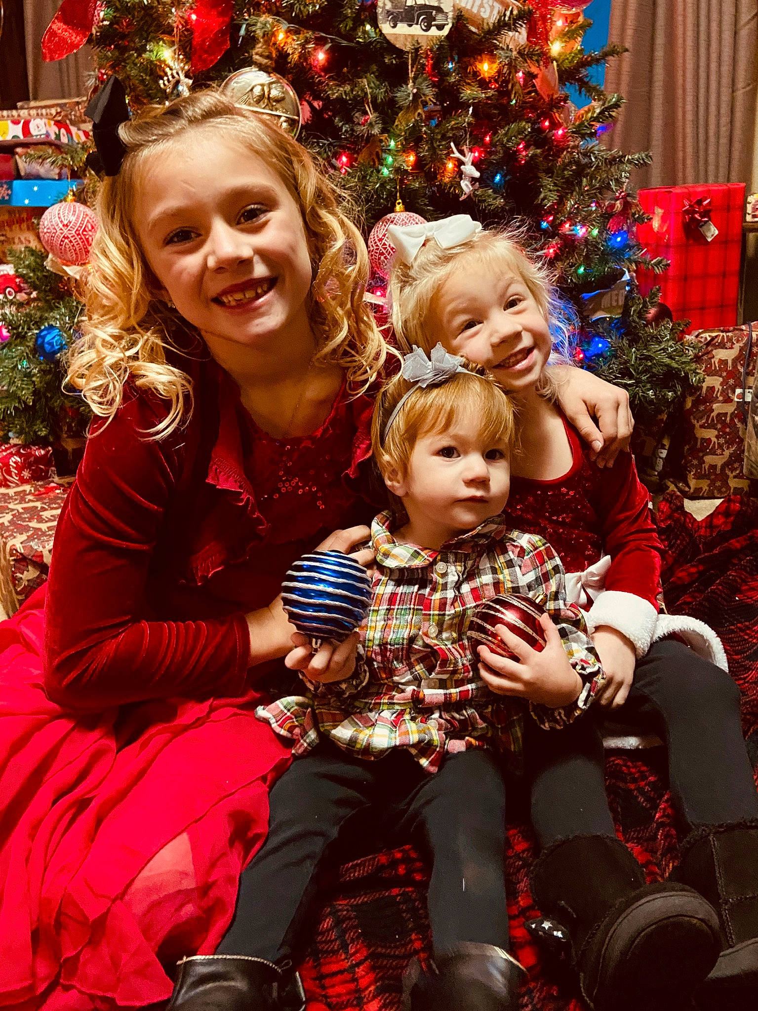 Aleeanna joined the competition — help win amazing prizes! blue, christmas, christmas_decoration, christmas_ornament, christmas_tree, clothing, facial_expression, fun, happy, holiday_ornament, joy, organ, people, person, photograph, plant, red, smile, standing, tartan