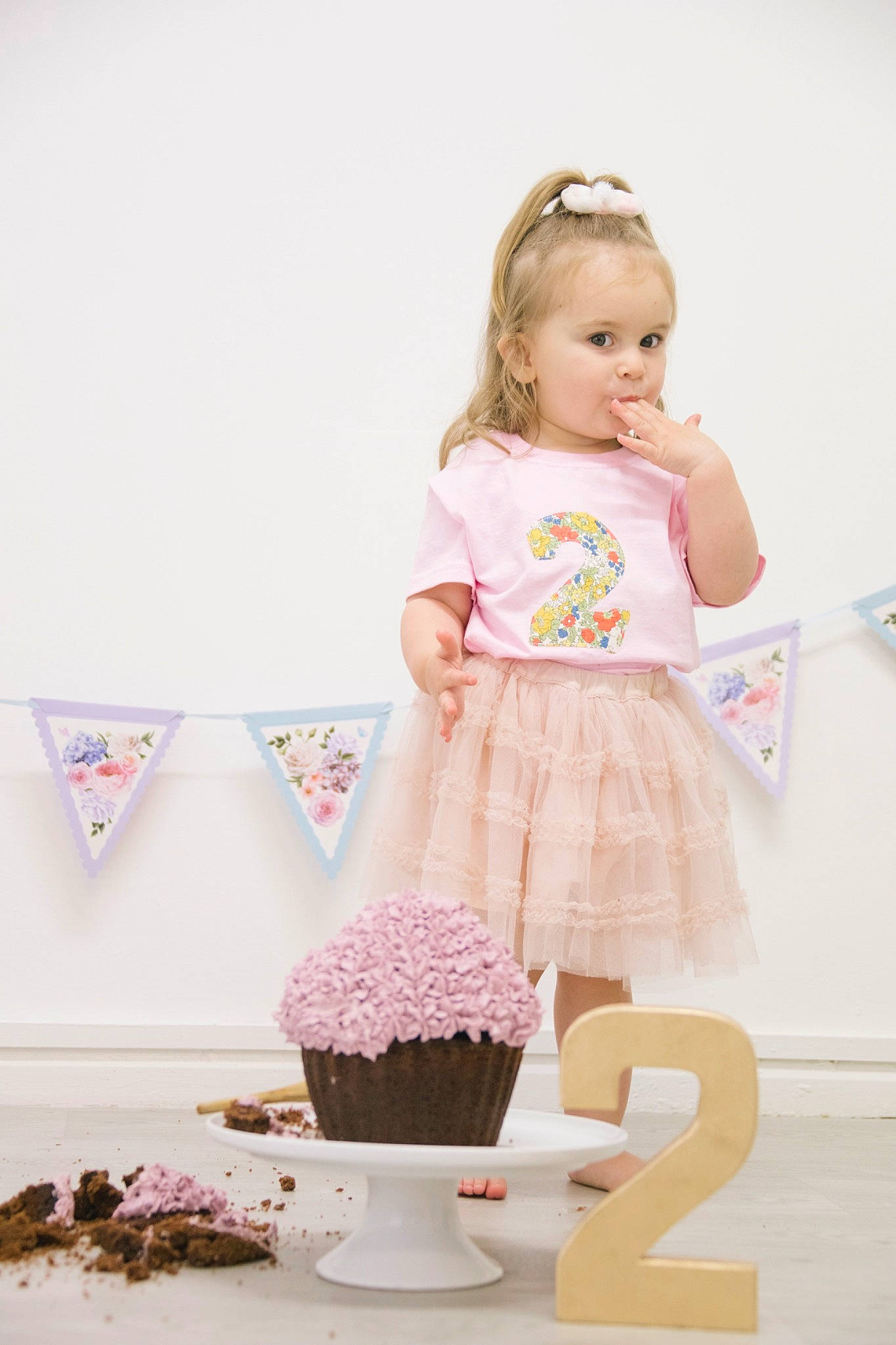 Ava-mae is registered to the contest to win money with this photo: baby, baby_toddler_clothing, child, clothing, dress, fashion_accessory, food, person, pink, product, ruffle, sweetness, t_shirt, toddler