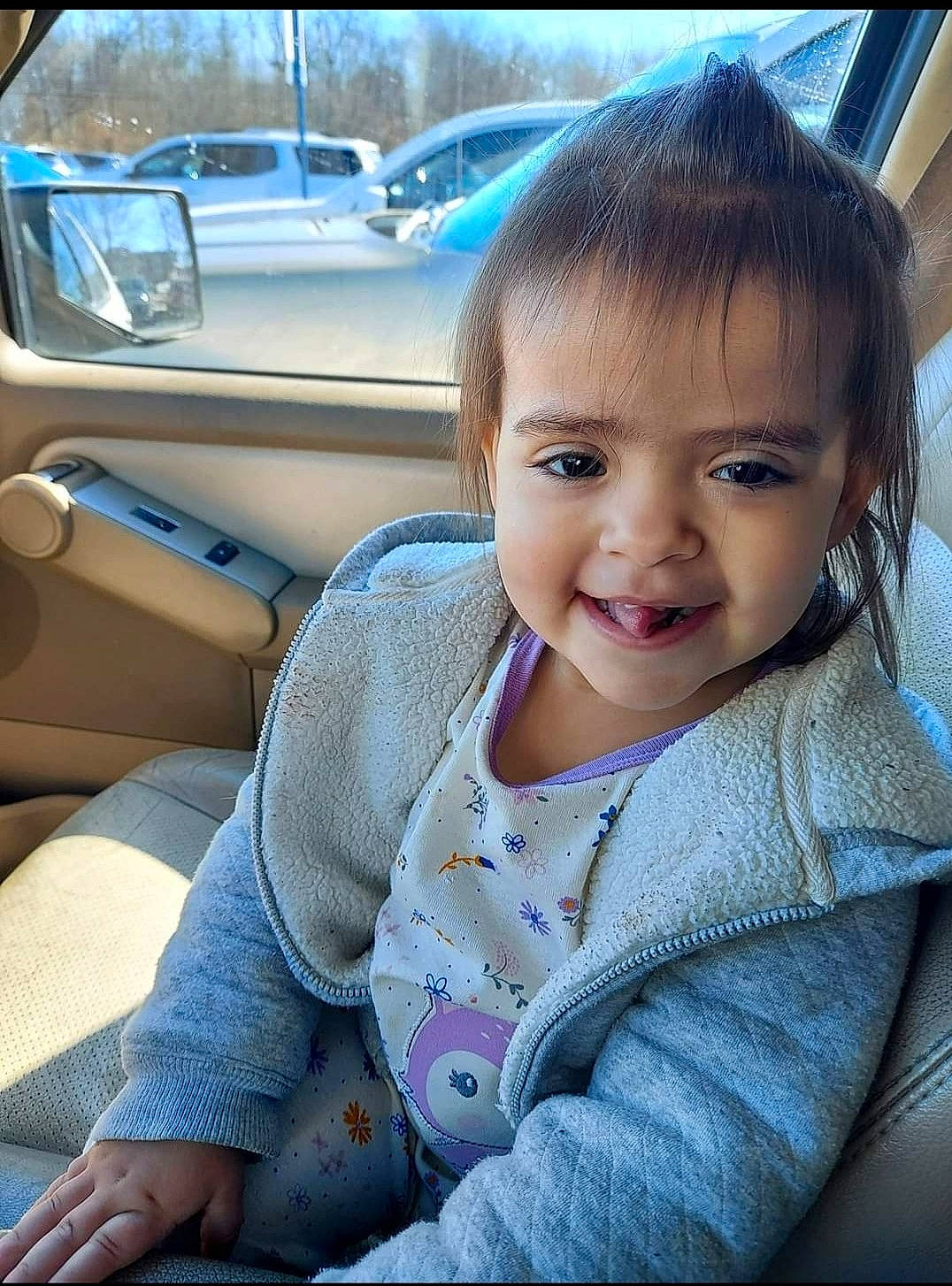 Gwynevere is registered to the contest to win money with this photo: auto_part, automotive_design, automotive_exterior, baby_toddler_clothing, car, car_seat, happy, iris, joy, lip, mammal, motor_vehicle, person, personal_luxury_car, skin, smile, steering_wheel, toddler, travel, vehicle