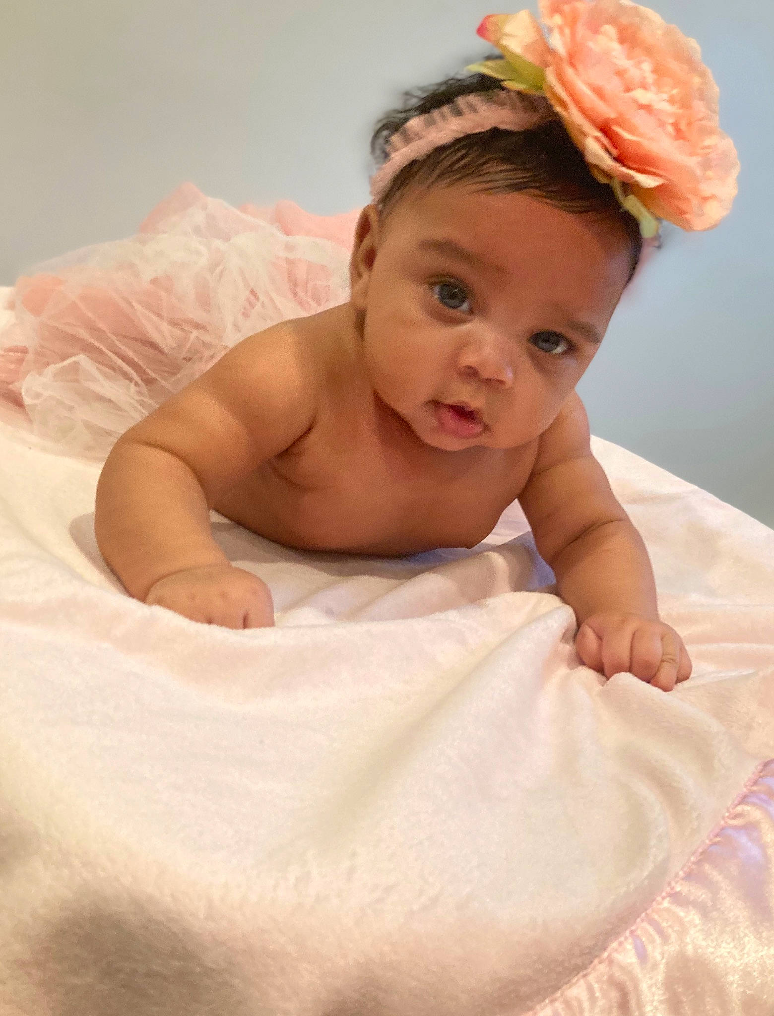 Iylah is registered to the contest to win money with this photo: artificial_flower, baby, baby_toddler_clothing, bonnet, costume_accessory, crown, embellishment, fashion_accessory, hair_accessory, headband, headgear, headpiece, linens, nose, peach, person, photography, portrait_photography, skin, stomach