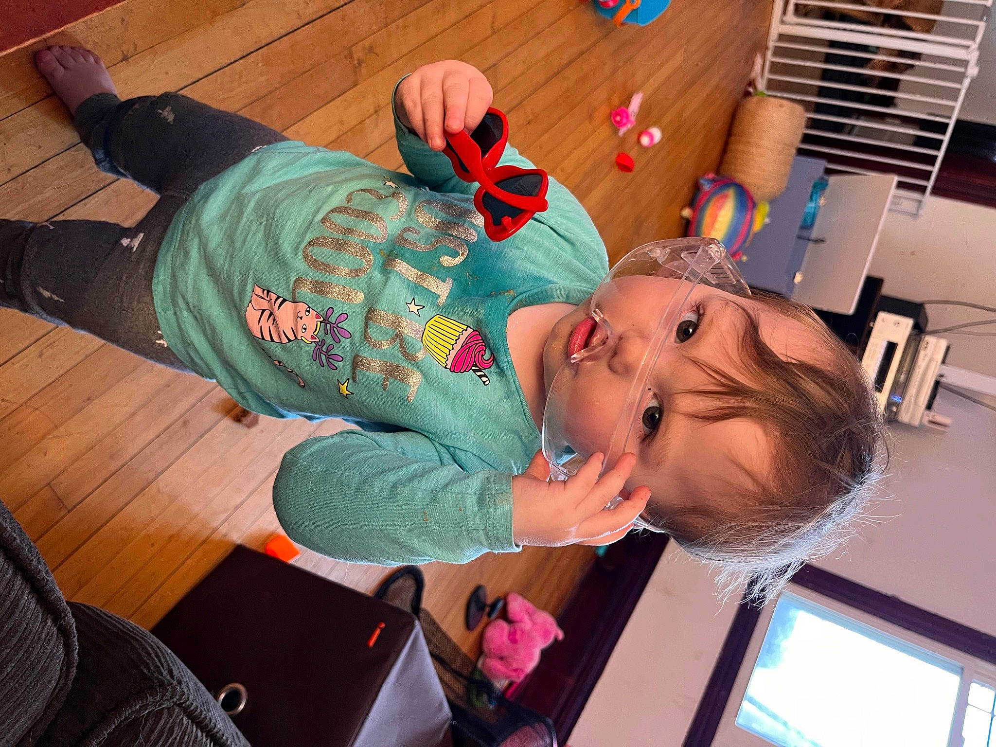 Ayva is registered to the contest to win money with this photo: baby, chair, child, comfort, flooring, fun, hat, knee, lap, leisure, person, room, t_shirt, toddler, vacation