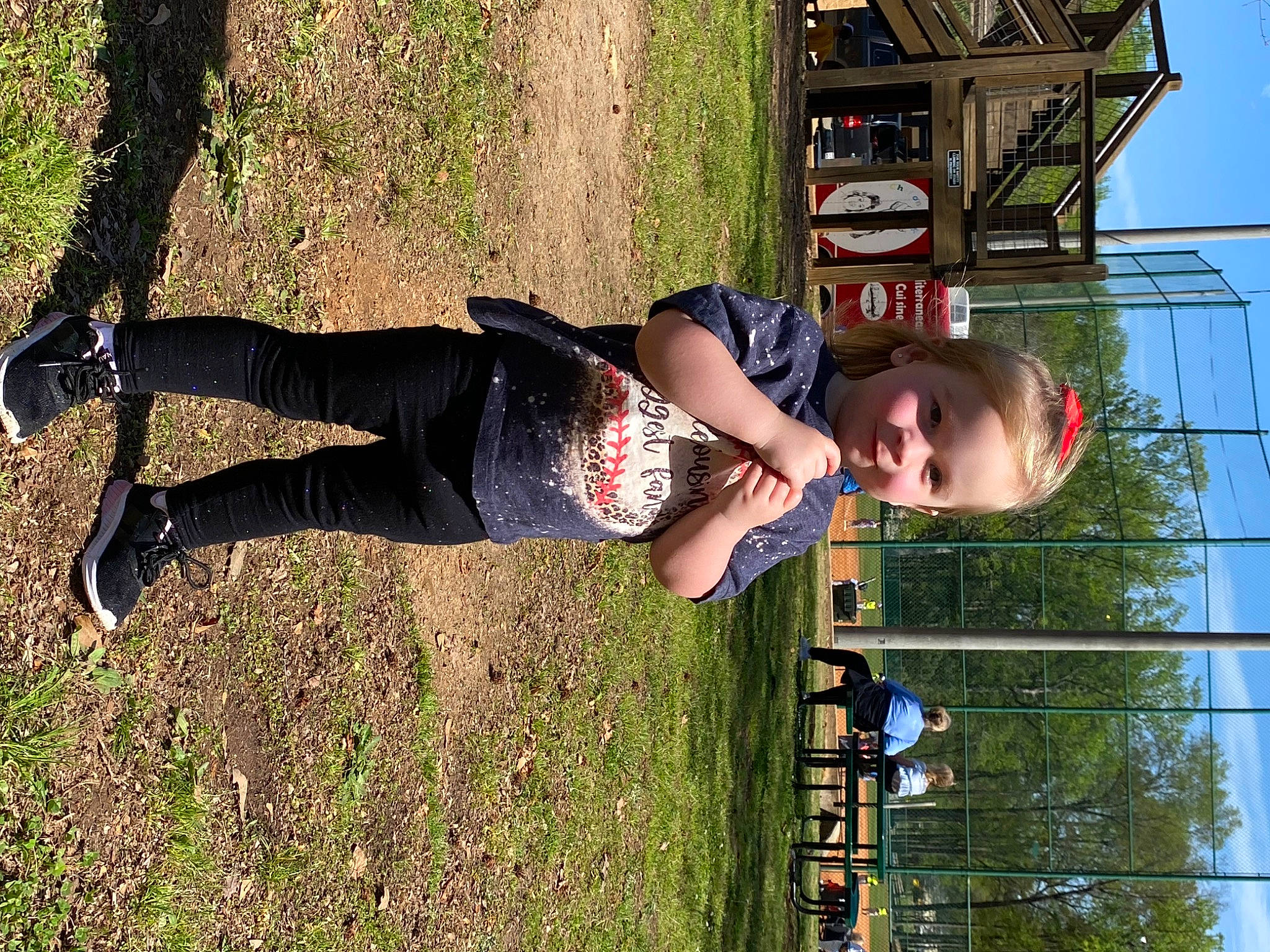 Addilyn is registered to the contest to win money with this photo: child, fun, grass, happy, human_leg, leisure, people_in_nature, person, plant, recreation, sky, smile, t_shirt, thigh, toddler, tree, walking_shoe