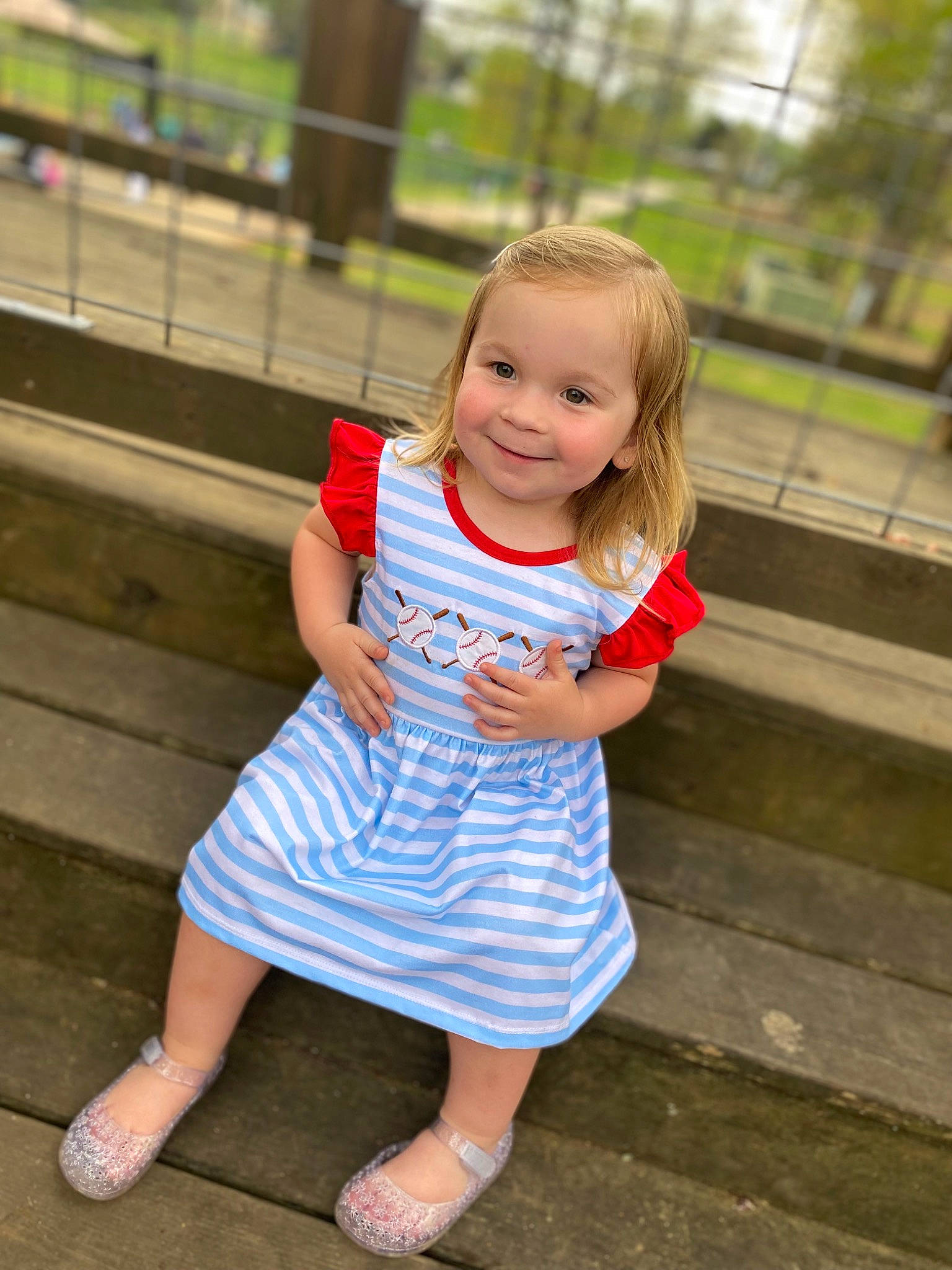 Addilyn joined the competition — help win amazing prizes! baby_toddler_clothing, child, day_dress, dress, electric_blue, eye, foot, fun, grass, happy, human_leg, joy, leisure, person, plant, recreation, sandal, smile, standing, toddler