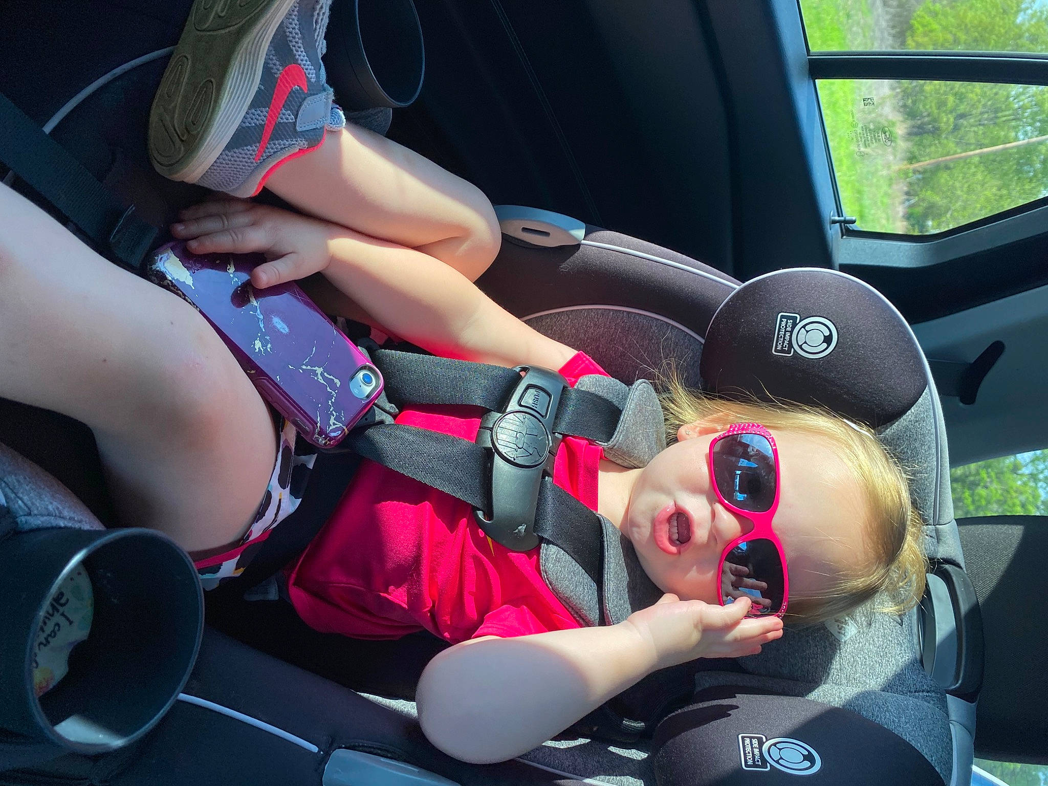 Addilyn is registered to the contest to win money with this photo: auto_part, automotive_design, automotive_exterior, car, car_seat, car_seat_cover, carmine, comfort, electric_blue, event, eyewear, family_car, head_restraint, human_leg, luxury_vehicle, motor_vehicle, person, service, steering_wheel, thigh