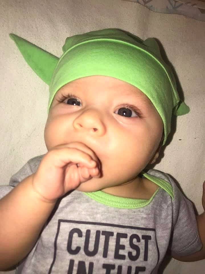 Kasey is registered to the contest to win money with this photo: baby, cap, cheek, clothing, ear, eyebrow, eyelash, finger, forehead, gesture, happy, headwear, iris, jaw, lip, mouth, nose, organ, person, skin