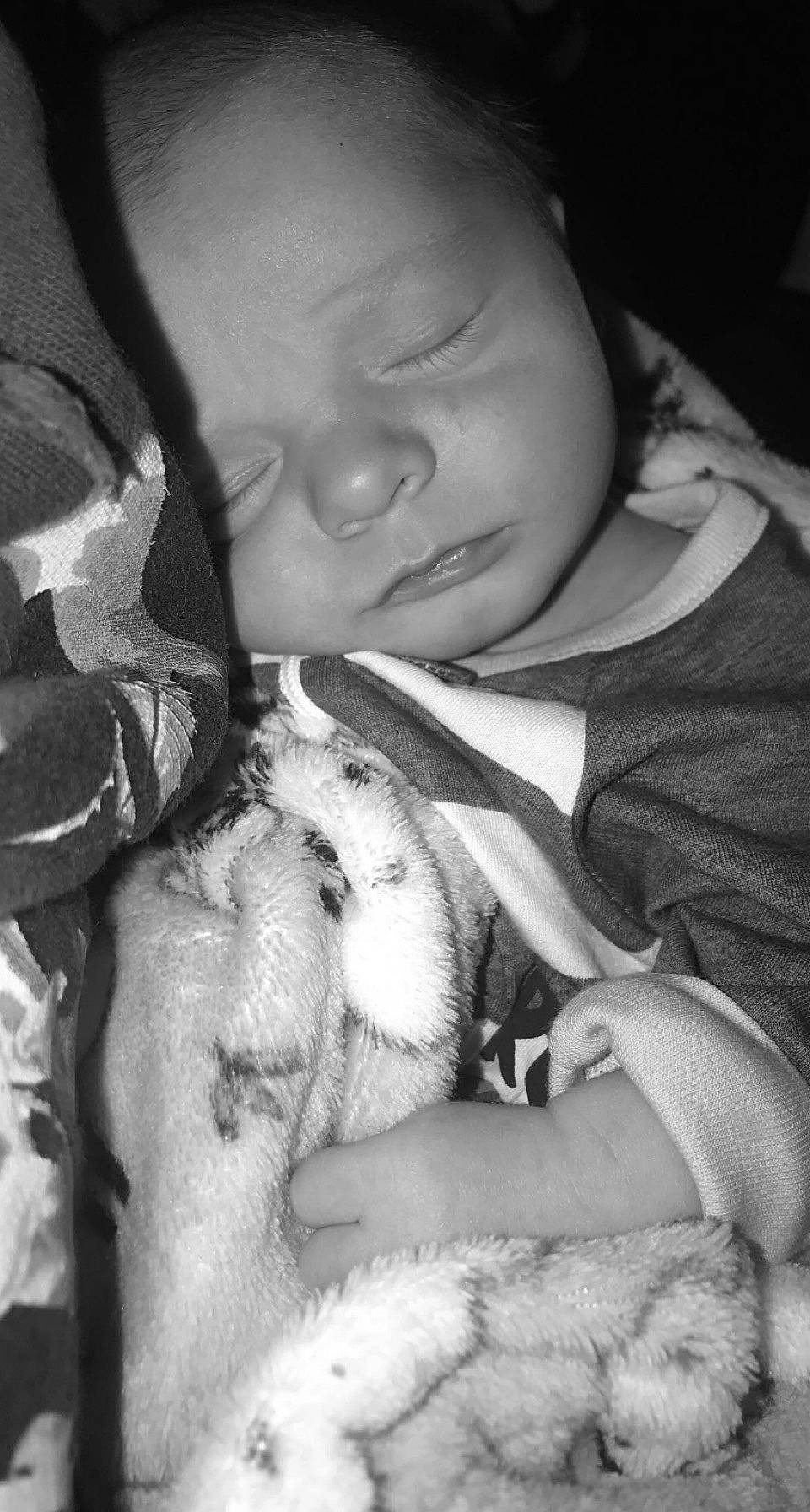 Kasey is registered to the contest to win money with this photo: baby, beard, black, comfort, companion_dog, eyebrow, finger, gesture, hand, happy, human, lip, mouth, nail, nose, person, skin, style, textile, toddler