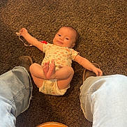 Bexleigh joined the competition — help win amazing prizes! baby, infant, carpet, floor, jeans, boots, person, child, indoor, pacifier, clothing, legs, casual, brown, blue, cute, smiling, playful, home, relaxed