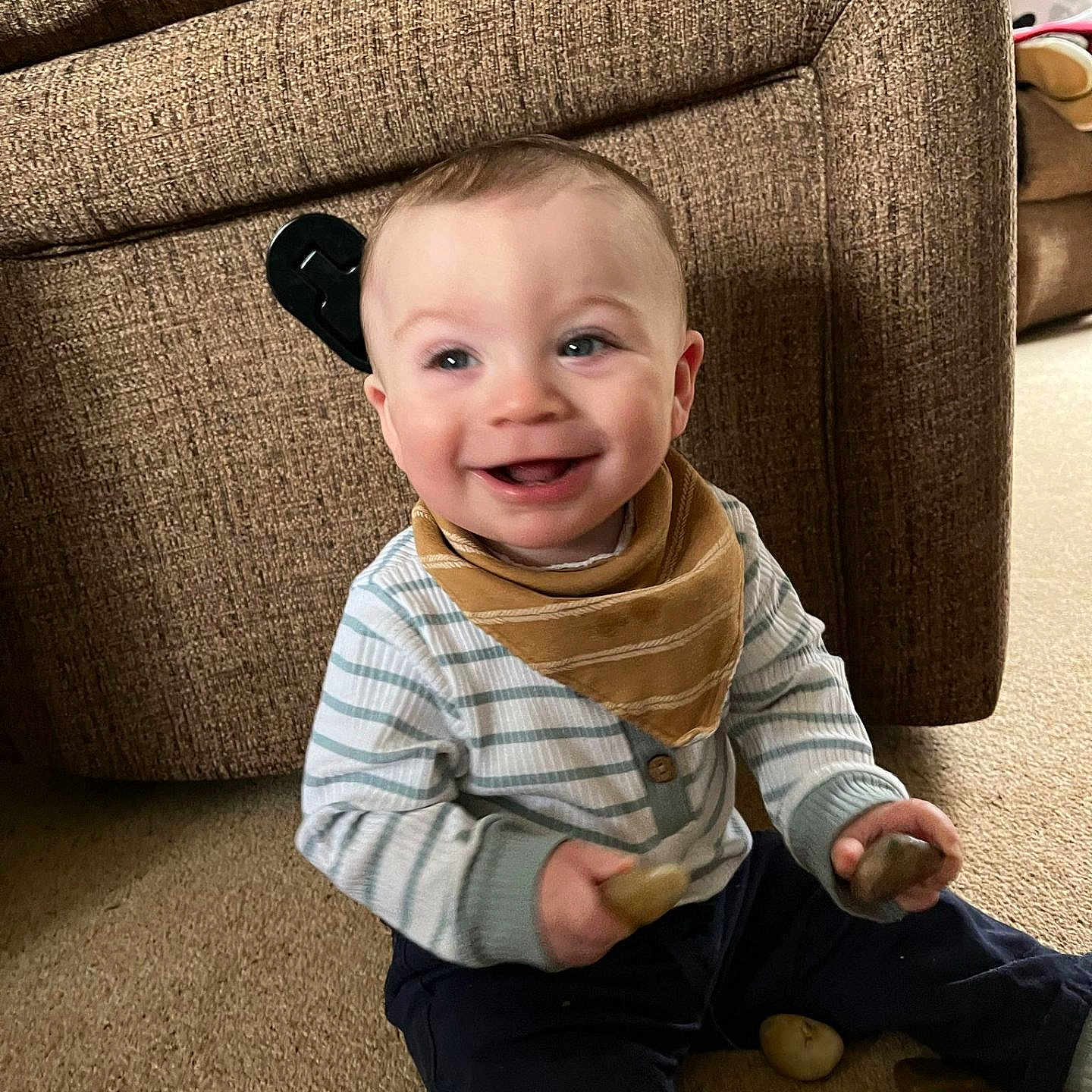 Odie-Ray is registered to the contest to win money with this photo: baby, babylaughing, chair, clothing, couch, cutlery, face, furniture, happy, head, jeans, laughing, pants, person, photography, portrait, scarf, sitting, smile, spoon