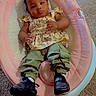 Kehlani is registered to the contest to win money with this photo: baby, child, infant, portrait, sitting, lying_down, bouncer, pink, dress, pants, shoes, smiling, pouting, face, indoors, carpet, furniture, playroom, photography, casual