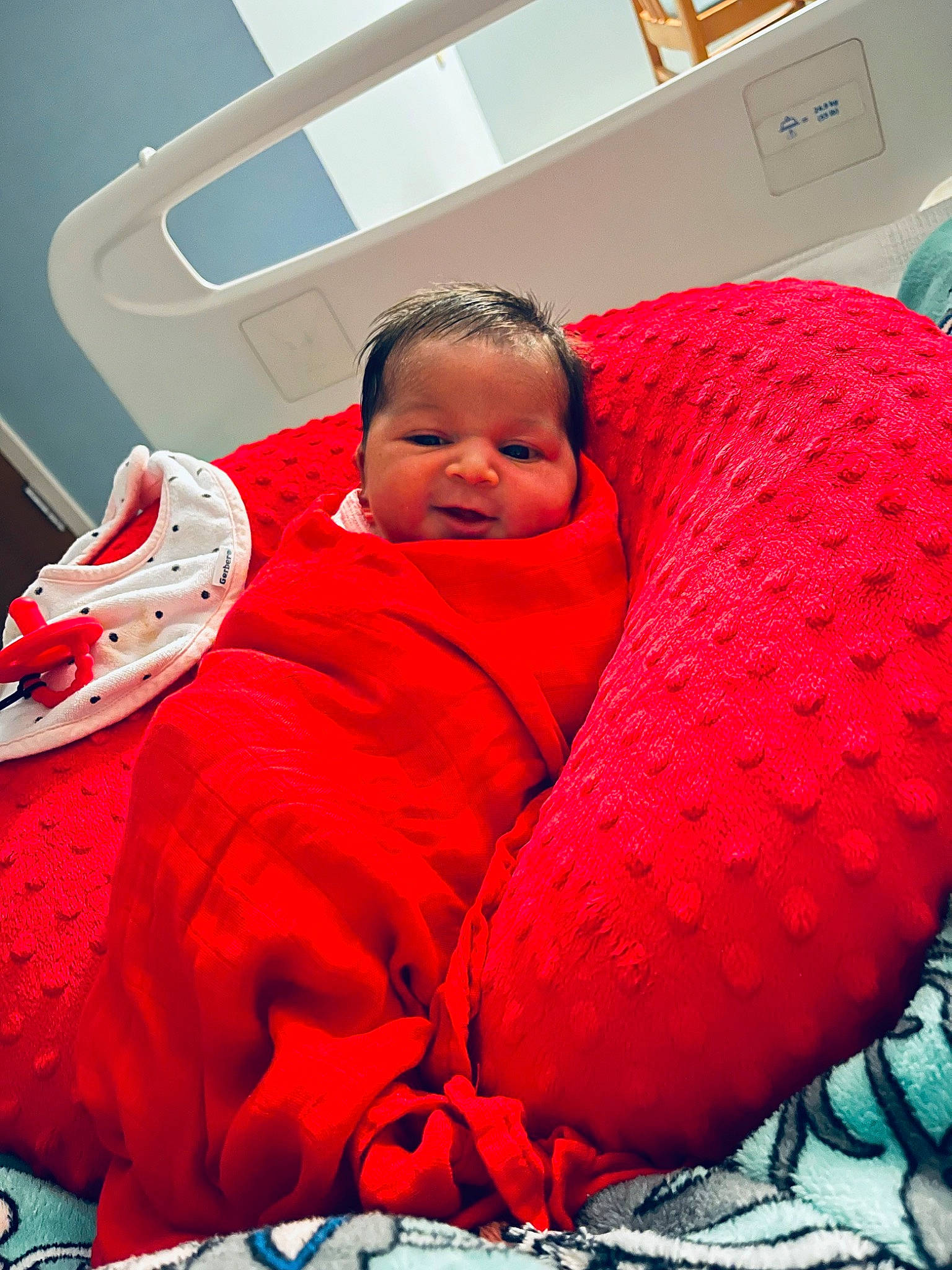 Kyndall is registered to the contest to win money with this photo: baby, bedding, carmine, cheek, child, comfort, computer_keyboard, fun, happy, linens, magenta, mouth, nap, person, room, sitting, smile, toddler, wool, woolen