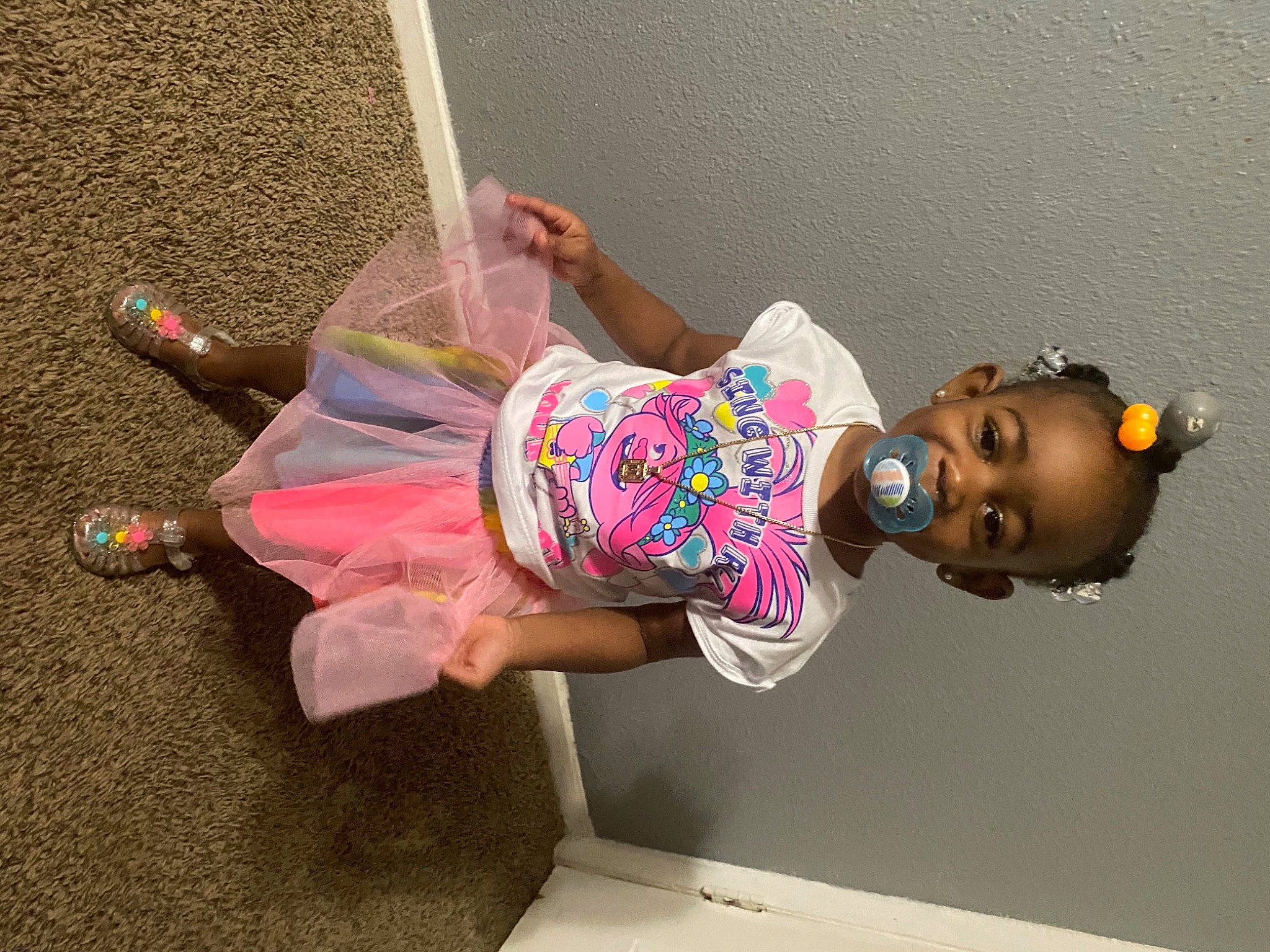 Marli is registered to the contest to win money with this photo: child, eyewear, fun, happy, hat, leisure, magenta, person, pink, room, smile, thigh, toddler, visual_arts, wall, window, wrist