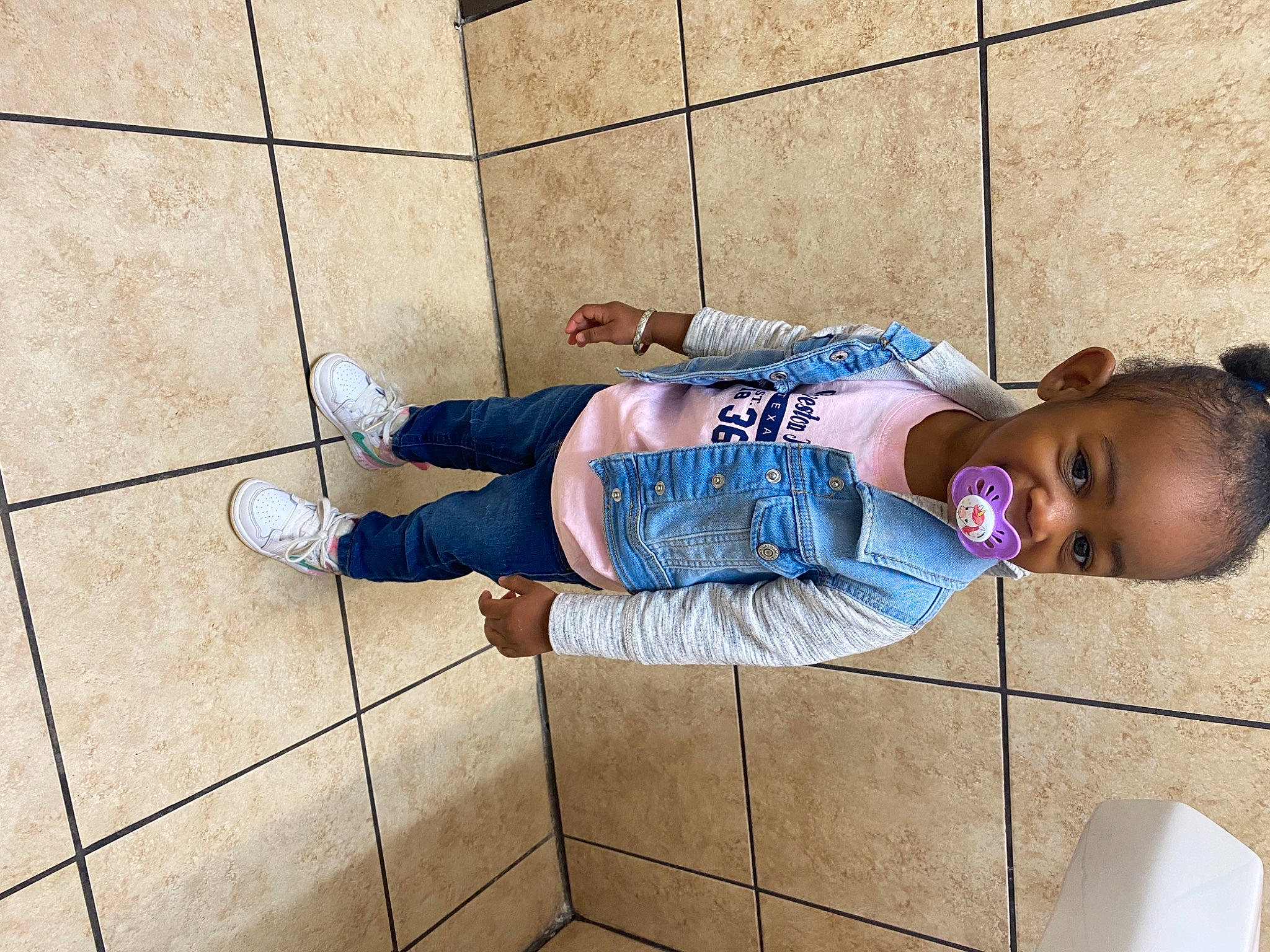 Marli is registered to the contest to win money with this photo: baby, baby_toddler_clothing, child, concrete, electric_blue, floor, flooring, fun, human_leg, leg, leisure, person, shoe, sidewalk, sitting, snapshot, sneakers, street_fashion, t_shirt, thigh