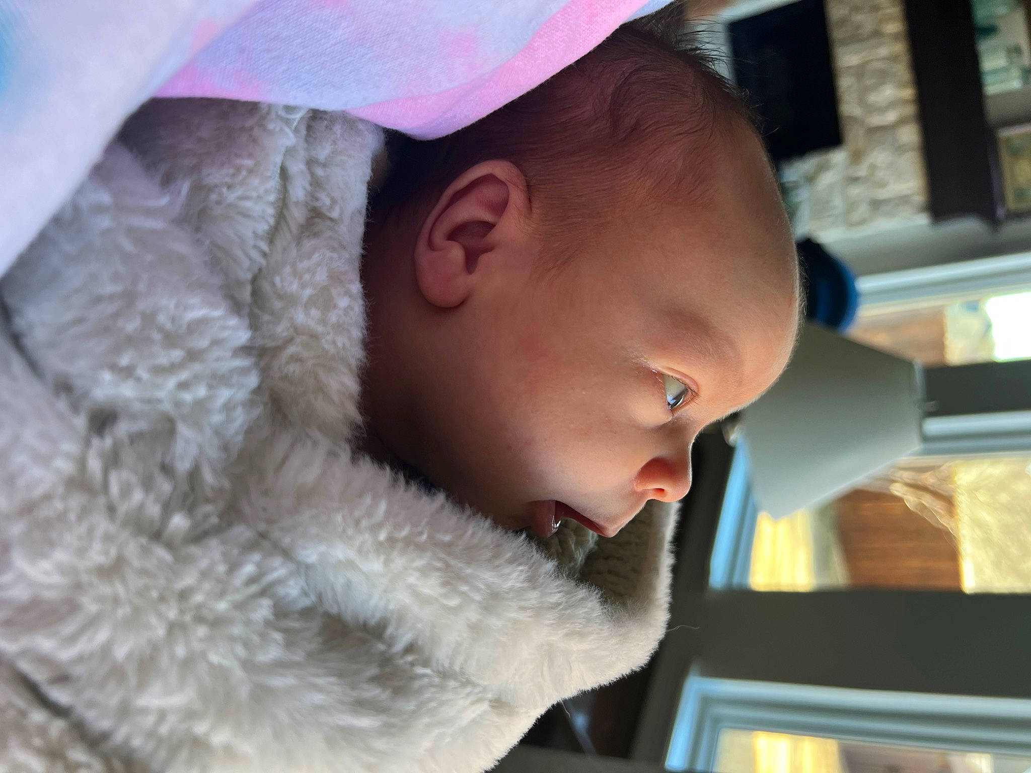 Waylon is registered to the contest to win money with this photo: auto_part, baby, baseball_cap, beard, cap, car_seat, child, driving, ear, fashion_accessory, fun, fur, fur_clothing, headgear, lip, mouth, nose, person, toddler, winter