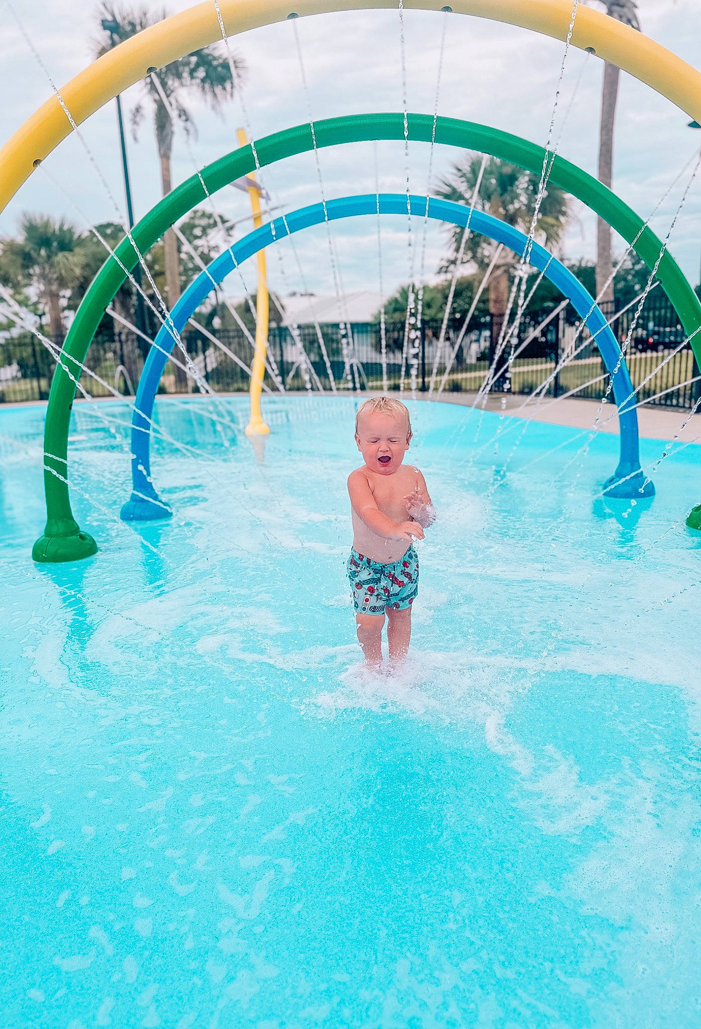 Kyren is registered to the contest to win money with this photo: amusement_park, aqua, azure, bathing, fluid, fun, leisure, leisure_centre, liquid, nonbuilding_structure, outdoor_recreation, person, recreation, resort, resort_town, sky, sorrow, swimming_pool, toddler, water