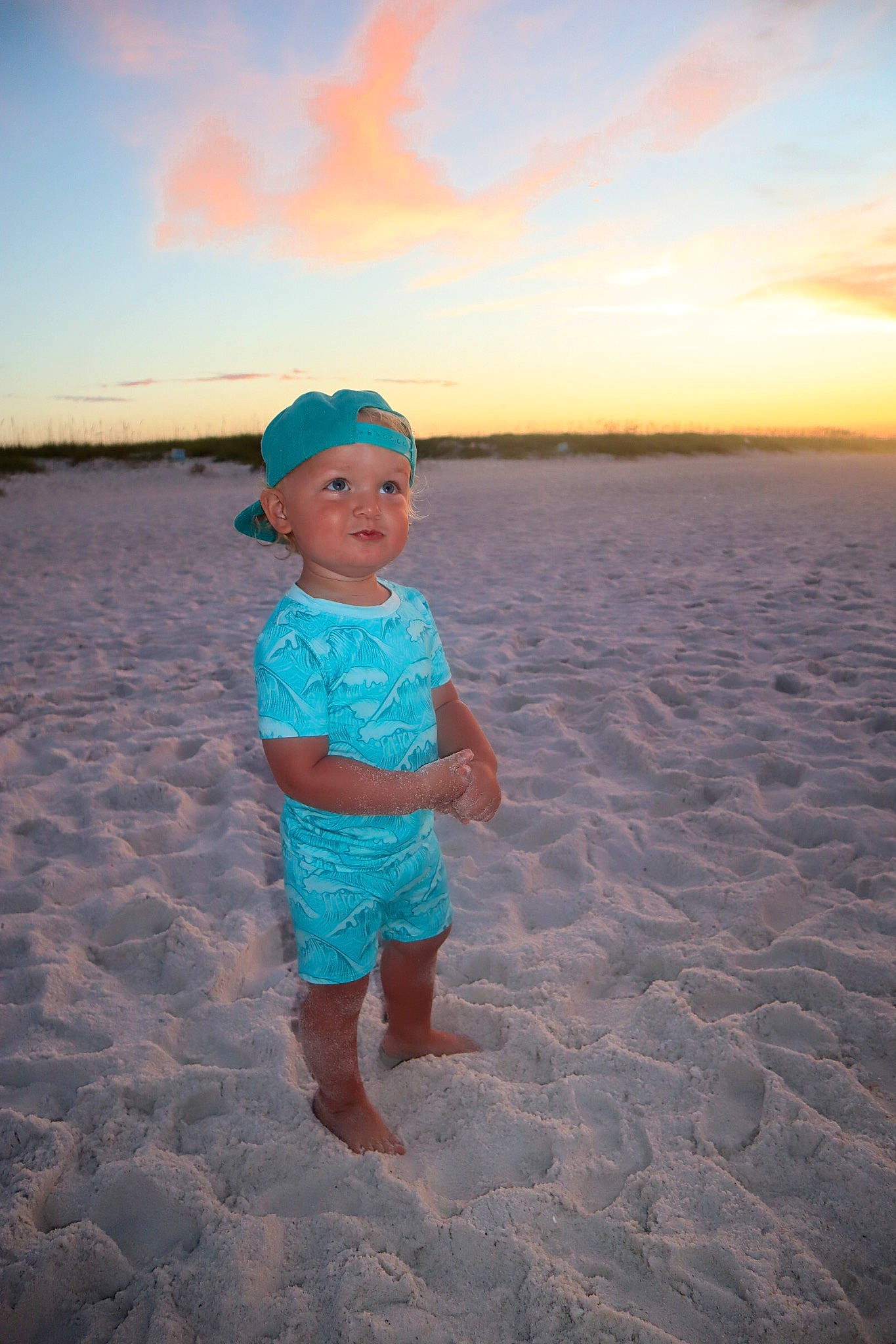 Kyren is registered to the contest to win money with this photo: azure, beach, cloud, coast, dusk, electric_blue, fun, happy, hat, headwear, horizon, landscape, ocean, people_in_nature, person, sand, shore, sky, summer, toddler