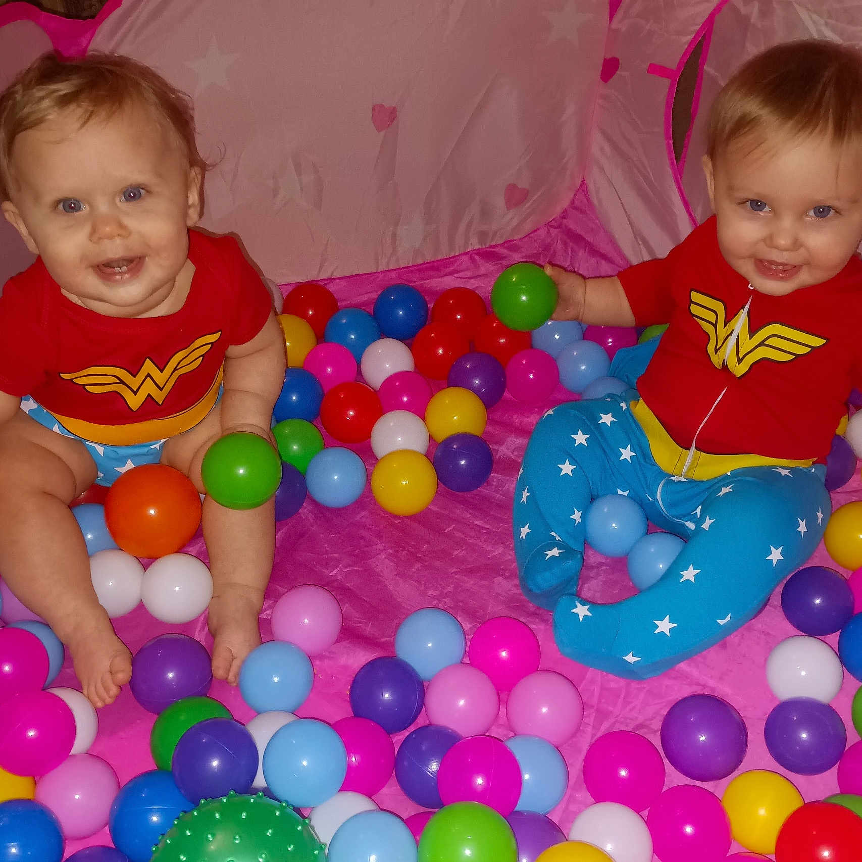 Jade And Jazmine is registered to the contest to win money with this photo: baby, balloon, candy, clothing, couch, face, food, furniture, head, indoors, inflatable, person, photography, play, playarea, portrait, sitting, sphere, sweets, t_shirt