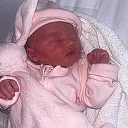 Valencia is registered to the contest to win money with this photo: newborn, baby, sleeping, pink_clothing, hat, plush_toy, bunny, blanket, soft, infant, cute, peaceful, hand, cozy, indoors, portrait, child, sleep, resting, toddler