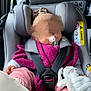 baby, car_interior, car_seat, child, clothing, hand, hat, headwear, infant, knitwear, pacifier, pink, purple, safety, seatbelt, sleeping, soft_toy, stuffed_animal, toy, transportation