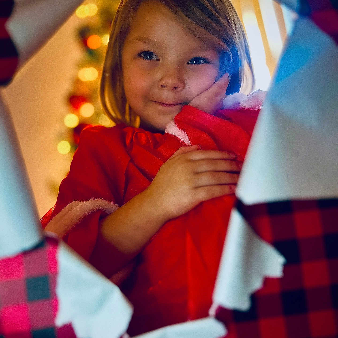 Lily joined the competition — help win amazing prizes! blanket, bodypart, child, clothing, couch, face, female, finger, furniture, girl, hand, happy, head, hood, knitwear, person, photography, portrait, smile, sweater