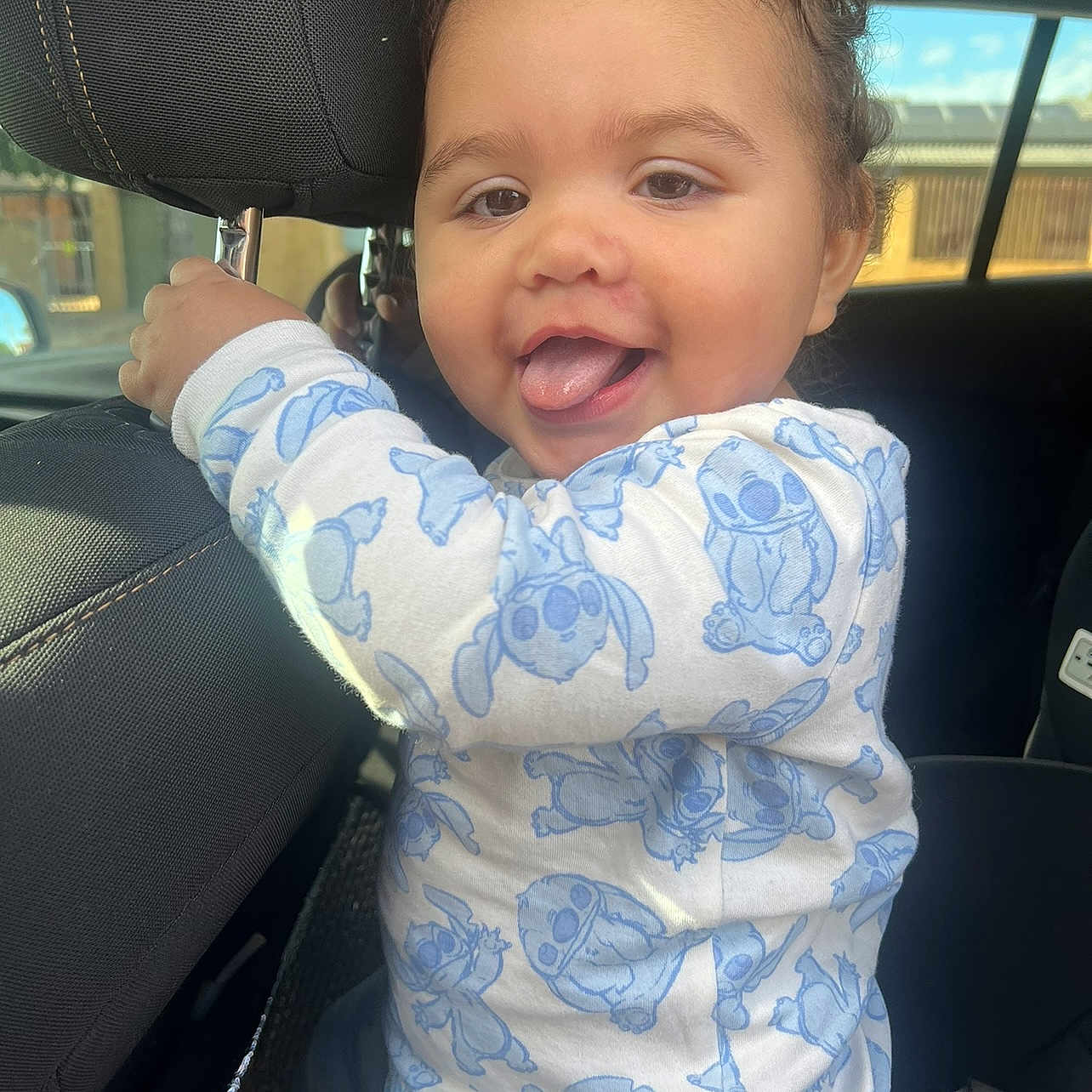 Avarni joined the competition — help win amazing prizes! baby, bodypart, clothing, cushion, dress, face, happy, head, headrest, homedecor, laughing, mouth, person, photography, portrait, sitting, t_shirt, teeth, transportation, vehicle