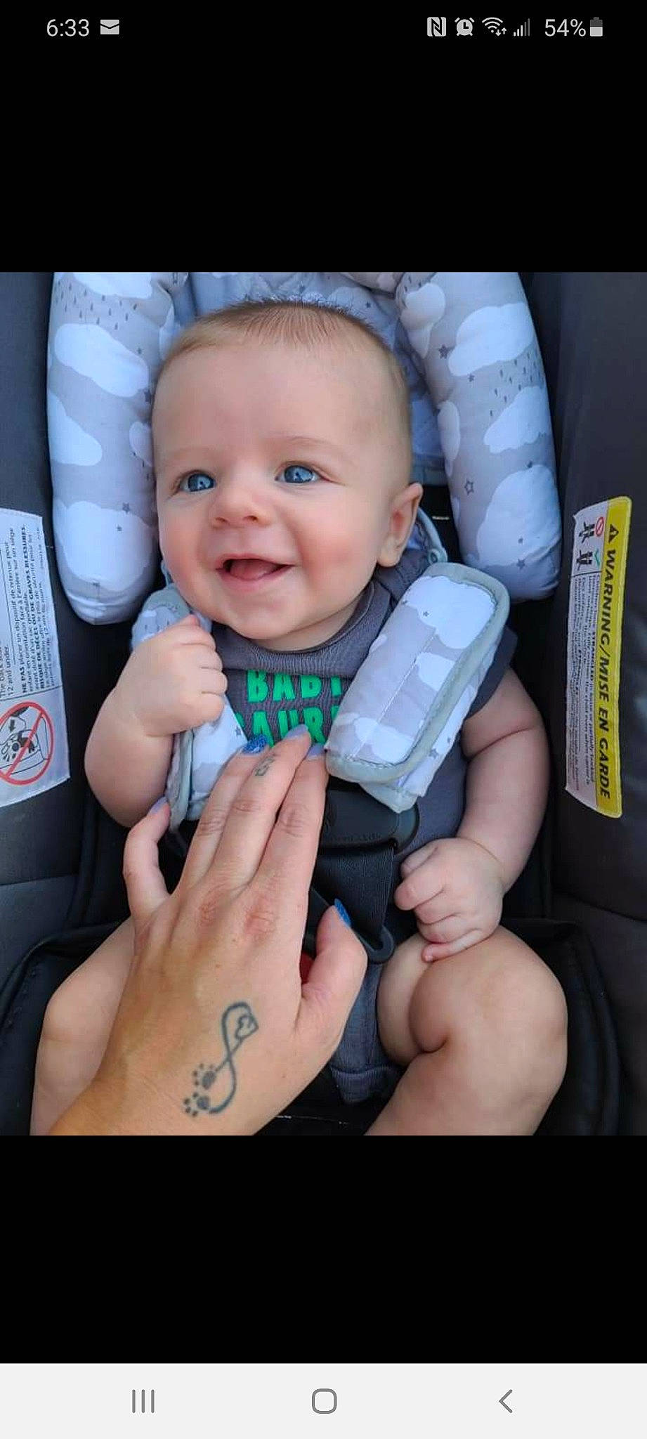 Conor is registered to the contest to win money with this photo: arm, baby, baby_toddler_clothing, cheek, comfort, eyebrow, eyelash, finger, flash_photography, gadget, gesture, hand, happy, mouth, nail, nose, person, skin, smile, thumb
