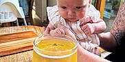 Eevee-Alice joined the competition — help win amazing prizes! baby, sunglasses, glass, cider, table, tattoo, arm, indoor, window, person, wood, drink, curious, child, pink_clothing, highchair, lamp, cozy, cafe, reflection