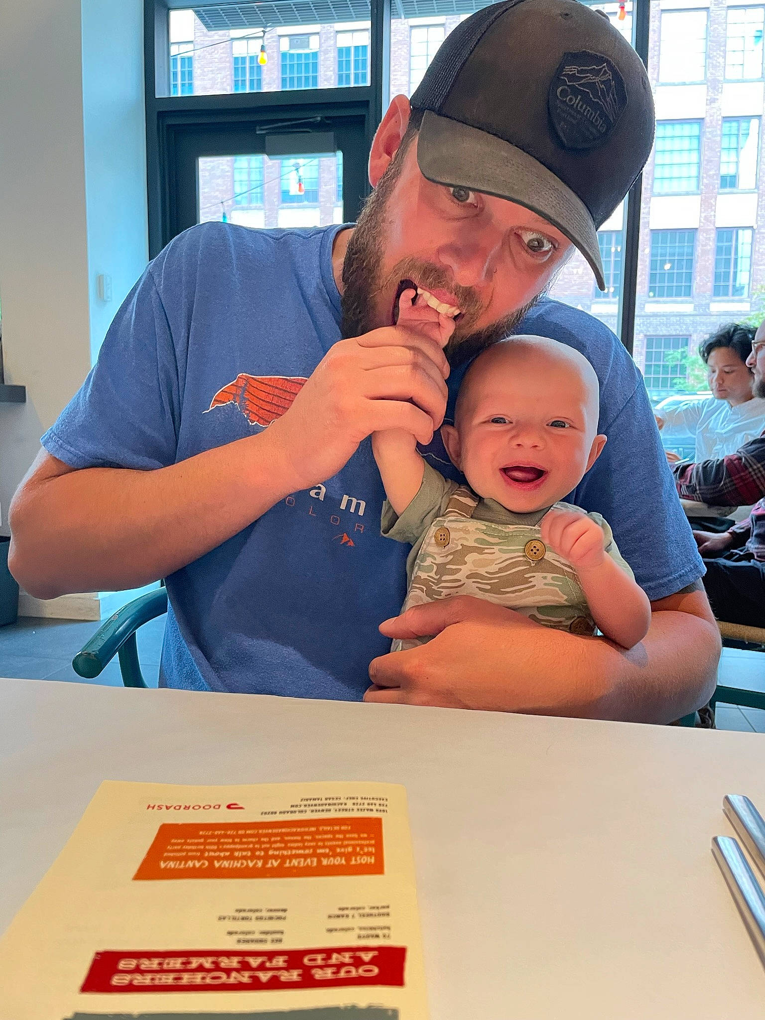 Travis joined the competition — help win amazing prizes! baby, baseball_cap, cap, chair, child, event, fun, happy, hat, headwear, job, leisure, person, recreation, room, shelf, smile, t_shirt, table, toddler