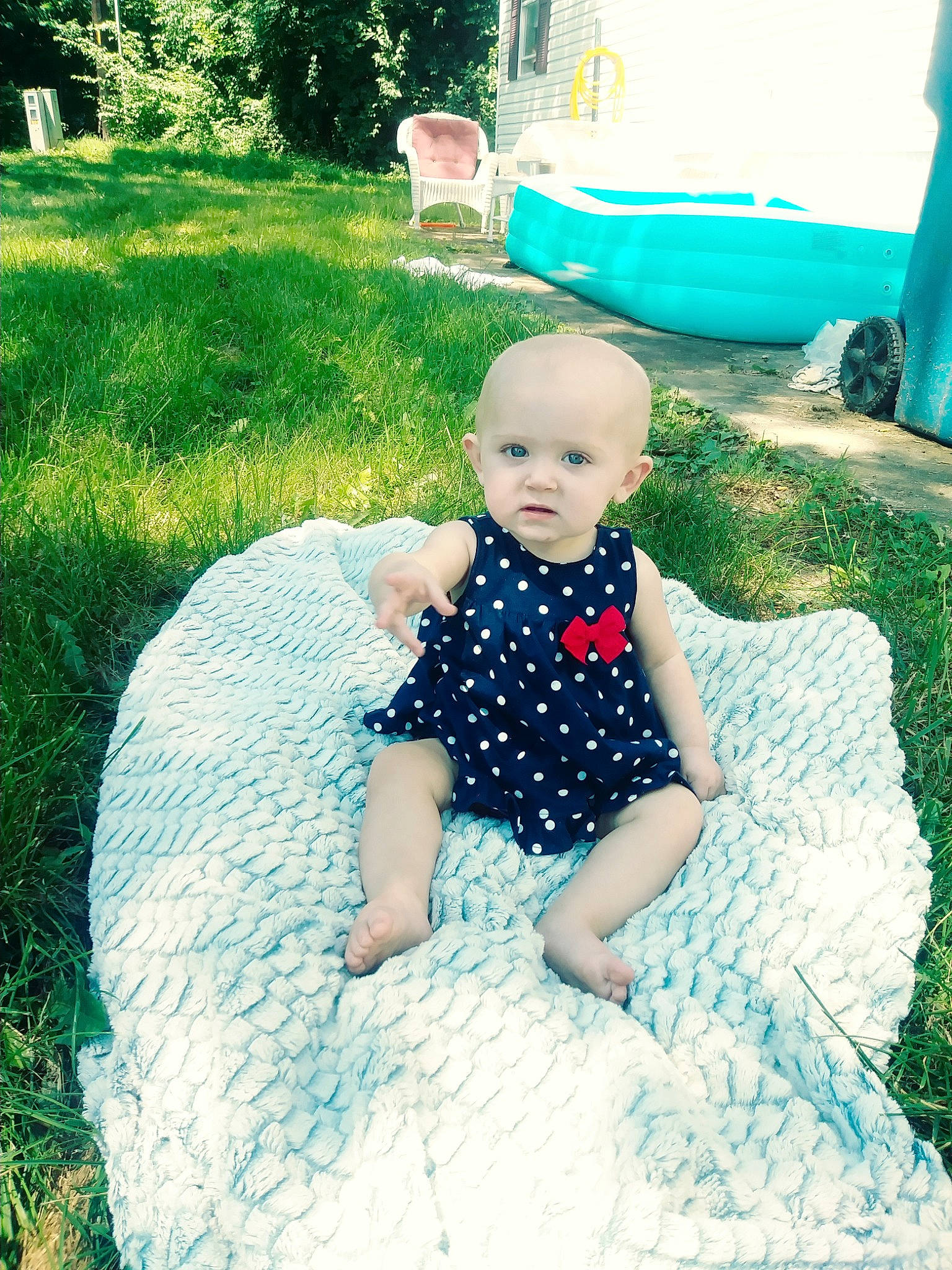 Varya is registered to the contest to win money with this photo: baby, backyard, child, dress, fun, grass, green, lawn, person, photograph, photography, plant, recreation, sitting, skin, smile, summer, toddler, tree, vacation