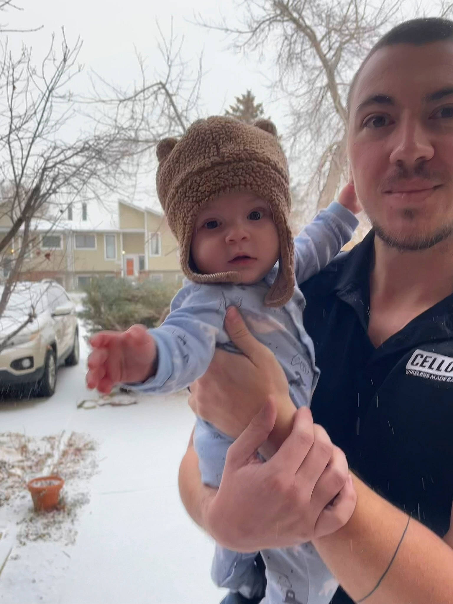 Emerson is registered to the contest to win money with this photo: baby, cap, car, child, face, freezing, fun, gesture, grass, happy, headwear, holding_hands, person, plant, skin, sky, thumb, tire, toddler, tree
