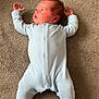 Arlo joined the competition — help win amazing prizes! baby, infant, onesie, carpet, floor, lying_down, newborn, child, person, sleepwear, cute, small_hands, blue_clothing, indoor, soft_texture, looking_away, human, baby_face, cozy, peaceful