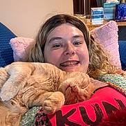 Zeus joined the competition — help win amazing prizes! cat, ginger_cat, sleeping, person, smiling, indoors, couch, blanket, pillow, cozy, portrait, close_up, whiskers, pink_nose, fur, relaxed, home, furniture, red_clothing, cuddling