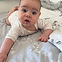 baby, infant, bed, blanket, onesie, curious, expression, indoor, pillow, soft, child, person, cute, reaching, face, head, skin, furniture, comfort, sleepwear