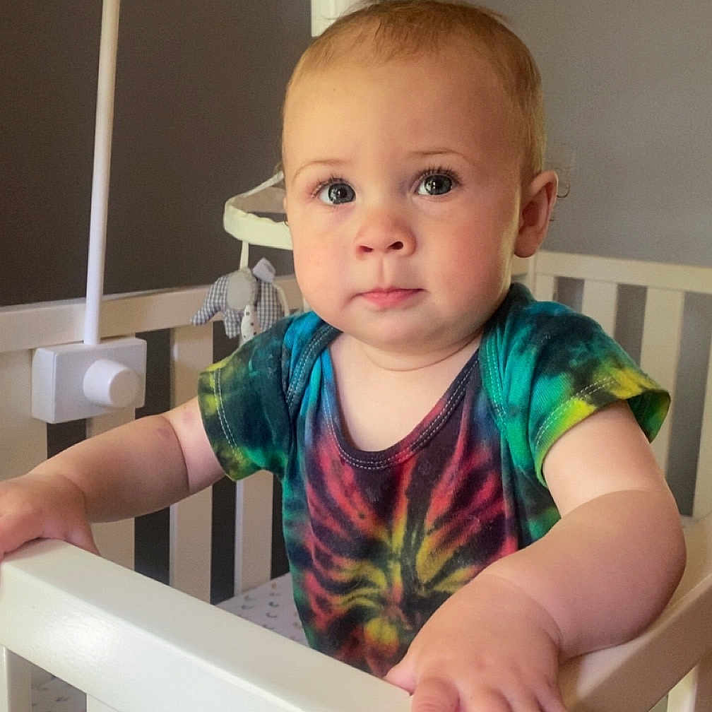 Jovie joined the competition — help win amazing prizes! baby, bed, clothing, cradle, crib, cushion, face, furniture, handrail, head, homedecor, indoors, infantbed, nursery, person, photography, portrait, room, standing, t_shirt