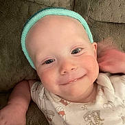 Phoenix joined the competition — help win amazing prizes! baby, child, smiling, headband, couch, infant, onesie, face, happy, closeup, portrait, skin, hand, cute, young, indoors, relaxed, comfort, expression, person
