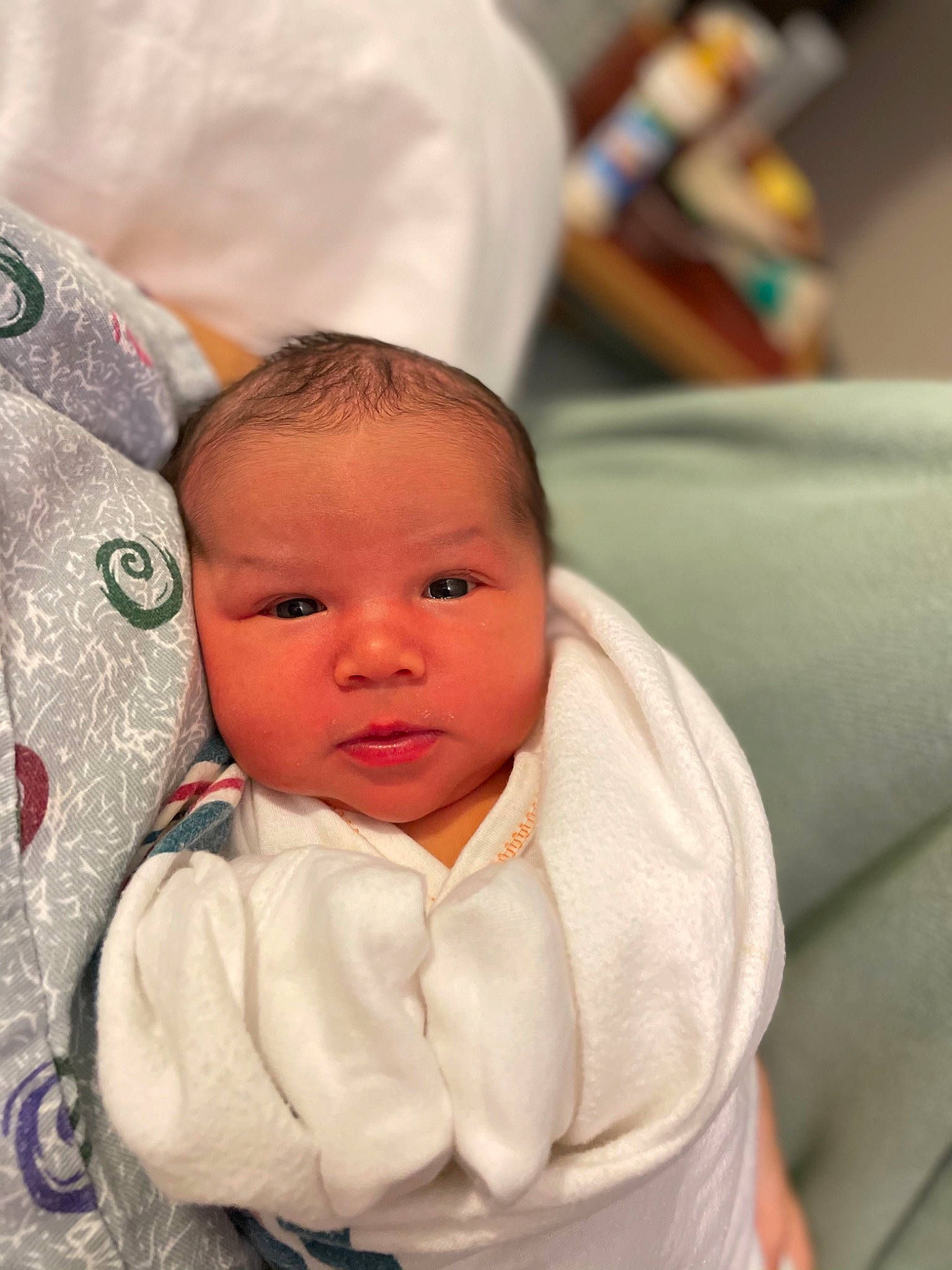 Kylani is registered to the contest to win money with this photo: baby, baby_products, baby_toddler_clothing, cheek, child, comfort, event, eye, eyebrow, fun, fur, gesture, happy, iris, linens, nose, person, room, sitting, sleeve