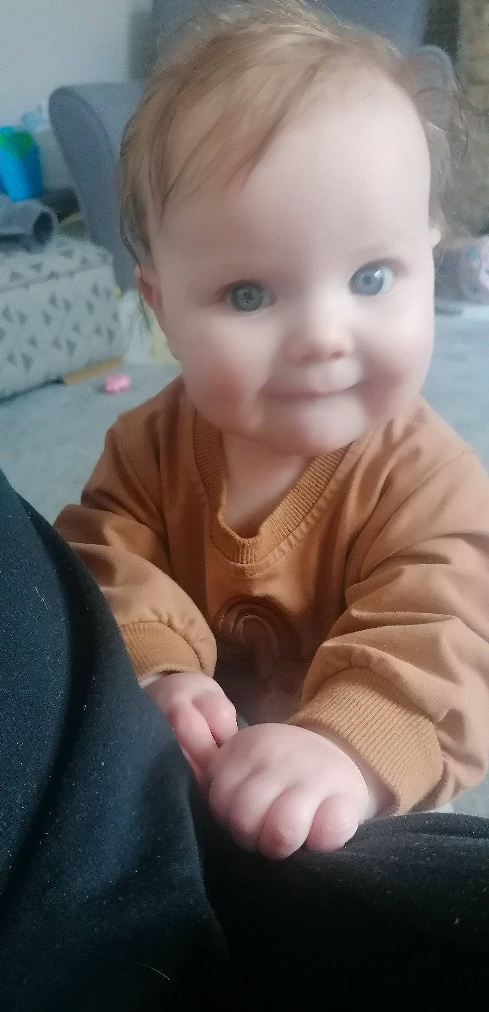 Freyja is registered to the contest to win money with this photo: arm, baby_toddler_clothing, cheek, chin, comfort, ear, eyebrow, finger, gesture, hand, head, human_body, iris, lip, mammal, mouth, nose, person, skin, sleeve