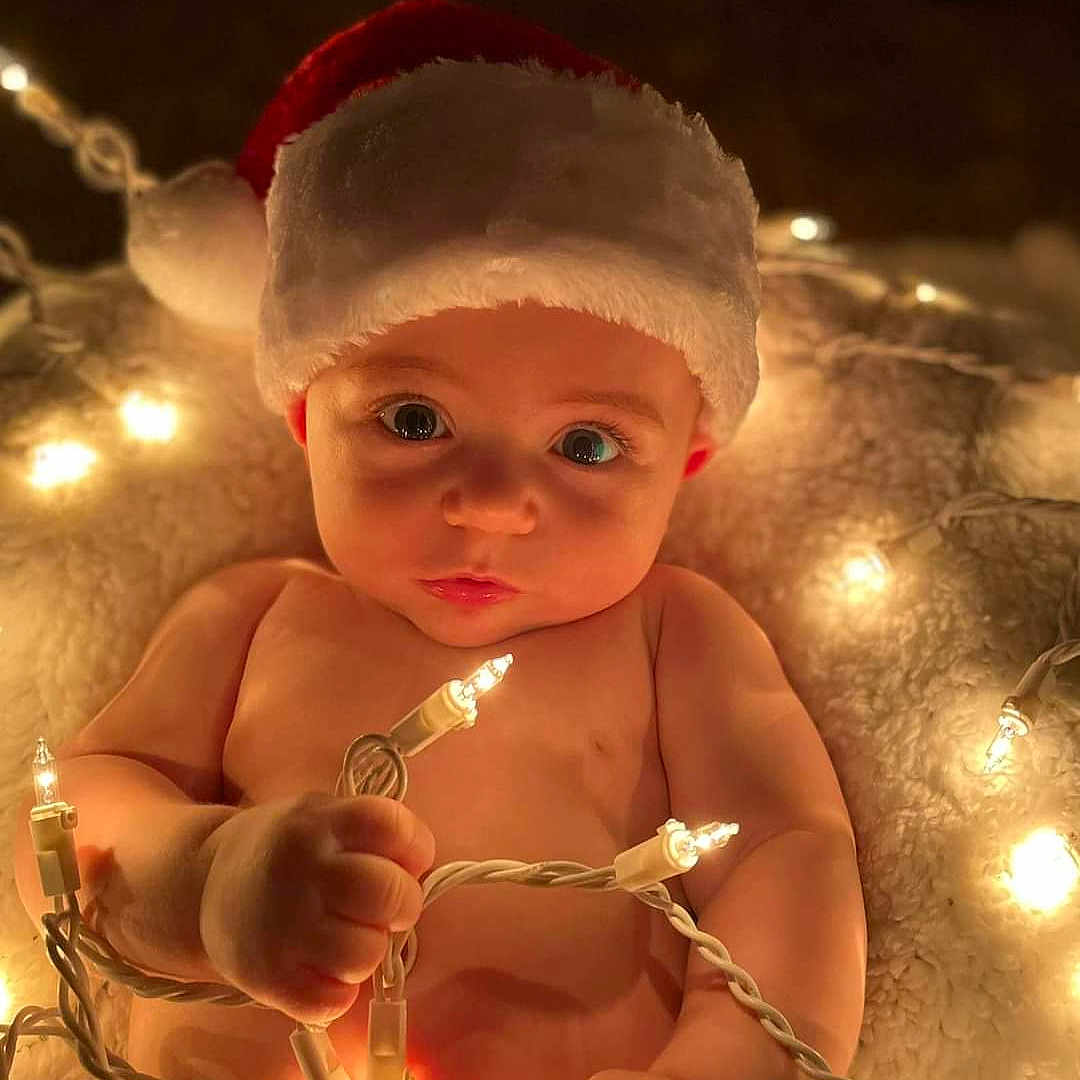 Raylan joined the competition — help win amazing prizes! abdomen, baby, cap, child, christmas_ornament, event, eye, face, flash_photography, fun, happy, head, holiday, human_body, jewellery, light, lighting, ornament, toddler, trunk