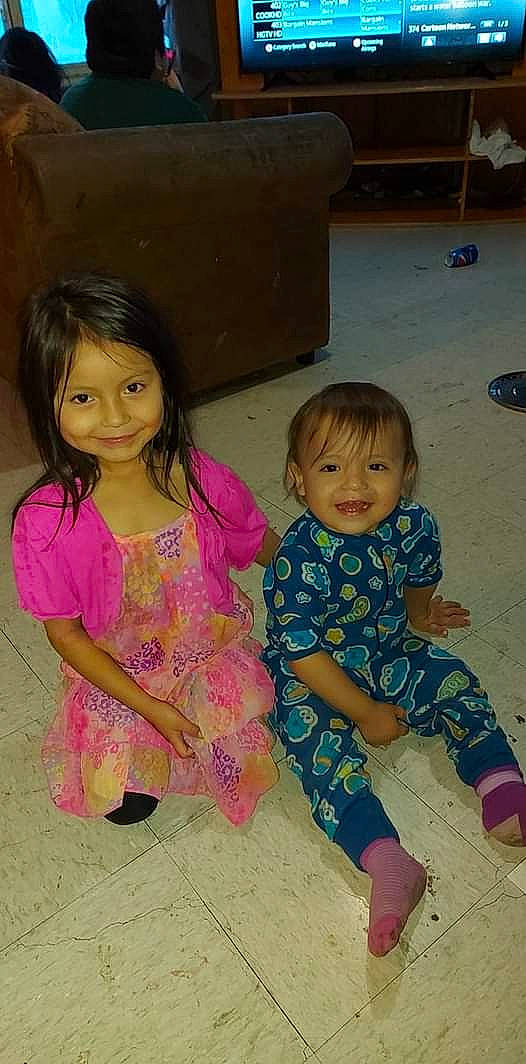 Ryleigh joined the competition — help win amazing prizes! baby_toddler_clothing, cheek, child, event, eye, face, fun, happy, head, iris, joy, leg, pattern, person, pink, sitting, skin, sleeve, smile, sock