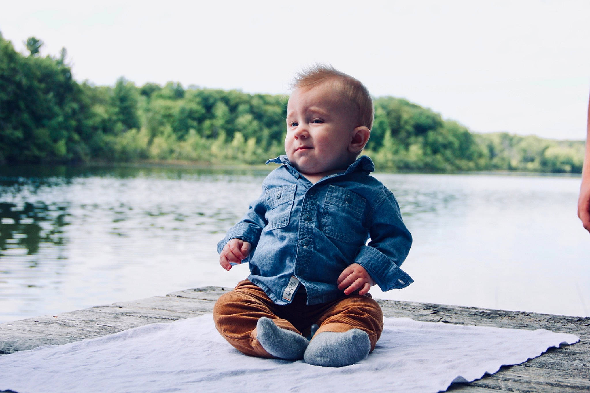 Trevor is registered to the contest to win money with this photo: baby, bank, child, lake, leisure, person, photograph, photography, play, portrait_photography, sitting, smile, toddler, vacation, water