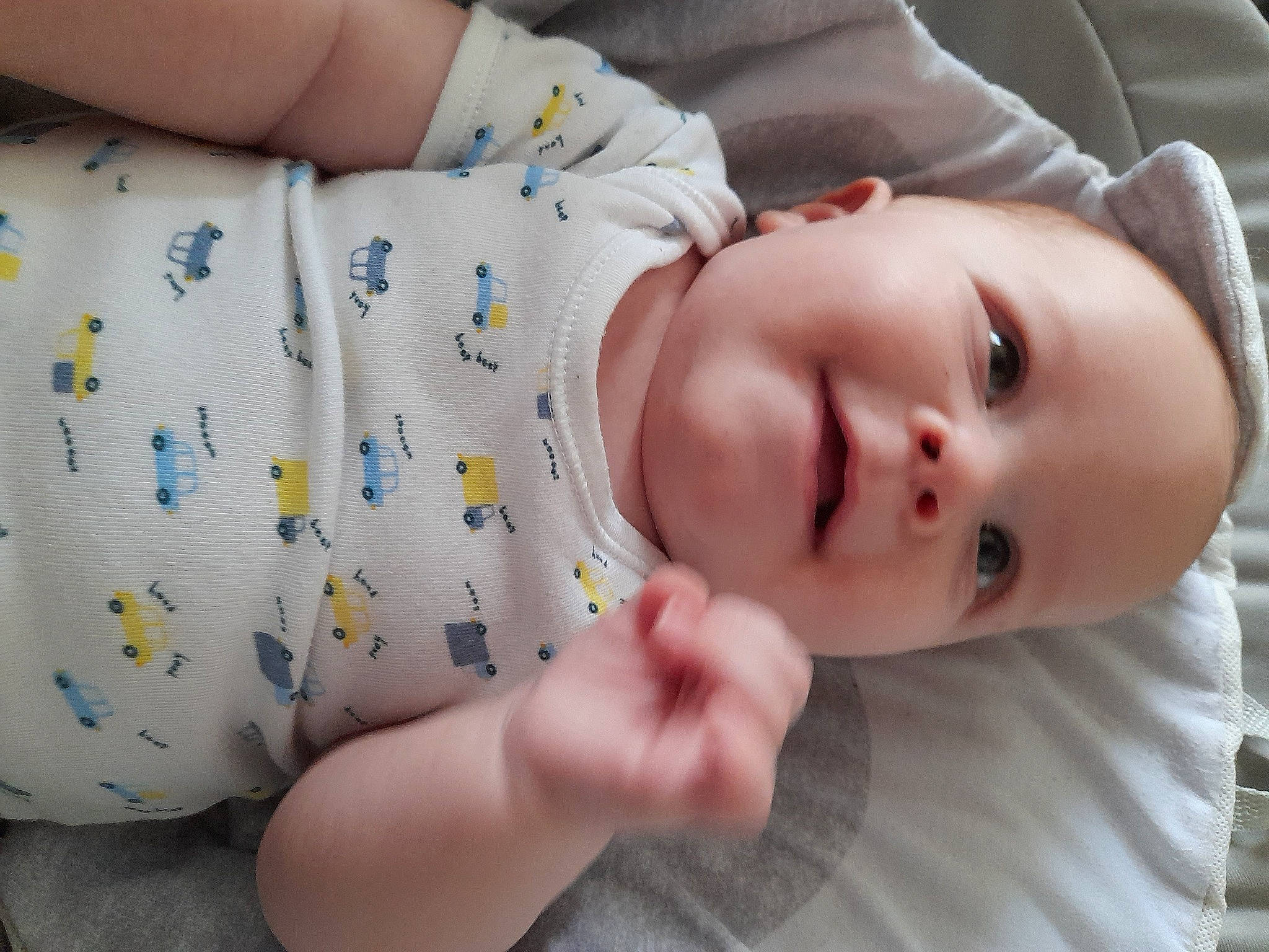 Ethan is registered to the contest to win money with this photo: baby, baby_products, baby_toddler_clothing, cheek, child, clothing, comfort, eye, eyelash, face, finger, lip, nail, nose, pattern, person, skin, sleeve, textile, thigh