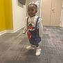 Taliyah joined the competition — help win amazing prizes! child, toddler, indoor, hallway, carpet, door, television, yellow_wall, white_bow, red_purse, strawberry, clothing, socks, shoes, smiling, person, cute, fashion, standing, wall