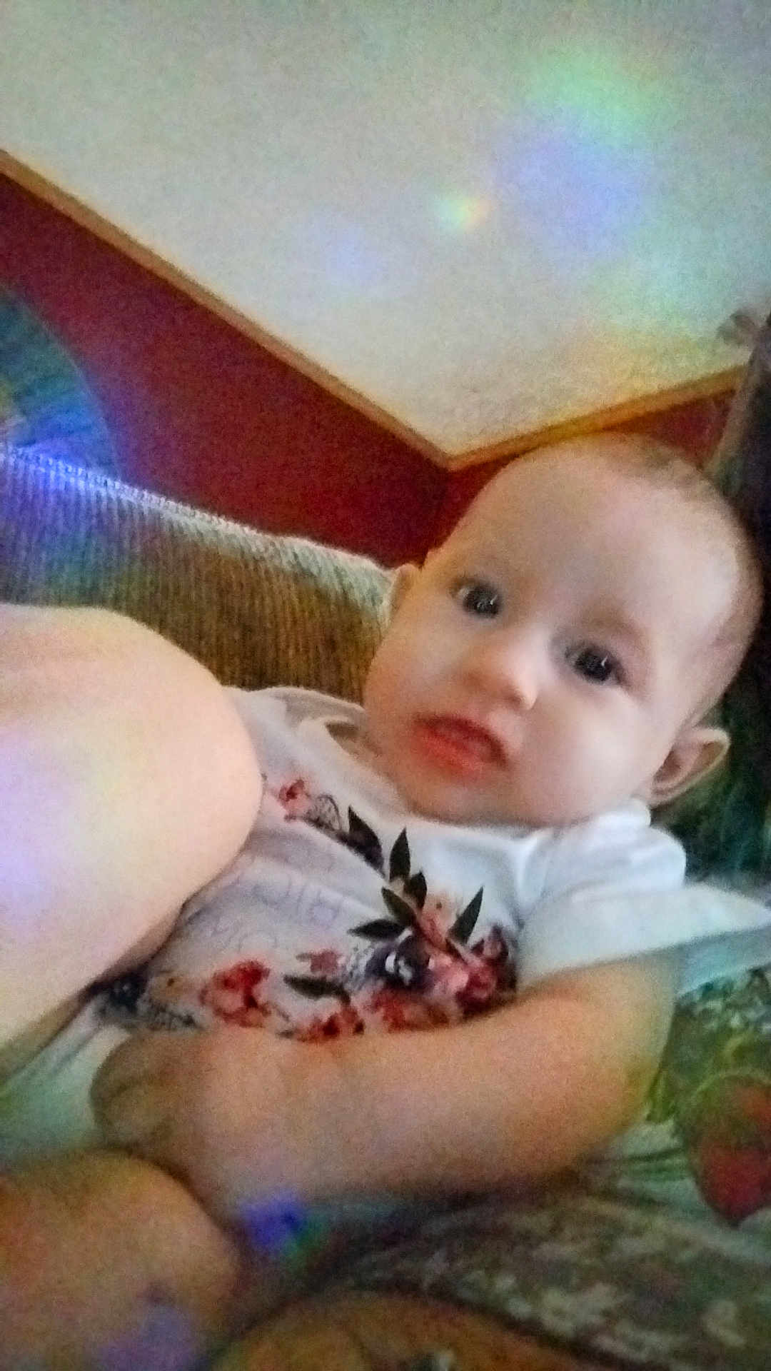 Roselyn joined the competition — help win amazing prizes! baby, infant, child, couch, sofa, floral_shirt, indoor, person, face, skin, arm, hand, leg, furniture, wall, light_reflection, comfort, casual, portrait, young