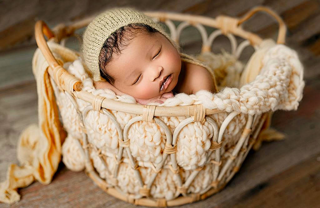 Aaliyah is registered to the contest to win money with this photo: baby, baby_products, baby_sleeping, baby_toddler_clothing, basket, child, comfort, event, fashion_accessory, flash_photography, happy, infant_bed, person, picnic_basket, plant, product, sitting, storage_basket, toddler, wicker