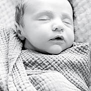 Sawyer joined the competition — help win amazing prizes! baby, newborn, infant, swaddle, blanket, sleeping, peaceful, face, head, closed_eyes, portrait, black_and_white, high_key, soft_texture, close_up, cozy, fabric, skin, mouth_open, tiny