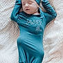 Sawyer is registered to the contest to win money with this photo: baby, newborn, infant, sleeping, teal_clothing, knotted_swaddle, hat, onesie, blanket, knit_texture, cozy, portrait, close_up, peaceful, indoors, soft_light, nursery, skin, face, resting