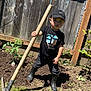 Xavier joined the competition — help win amazing prizes! child, boy, garden, hoe, soil, boots, black_cap, fence, plants, outdoor, sunny, grass, young, determined, yard, gardening, clothing, daytime, person, nature