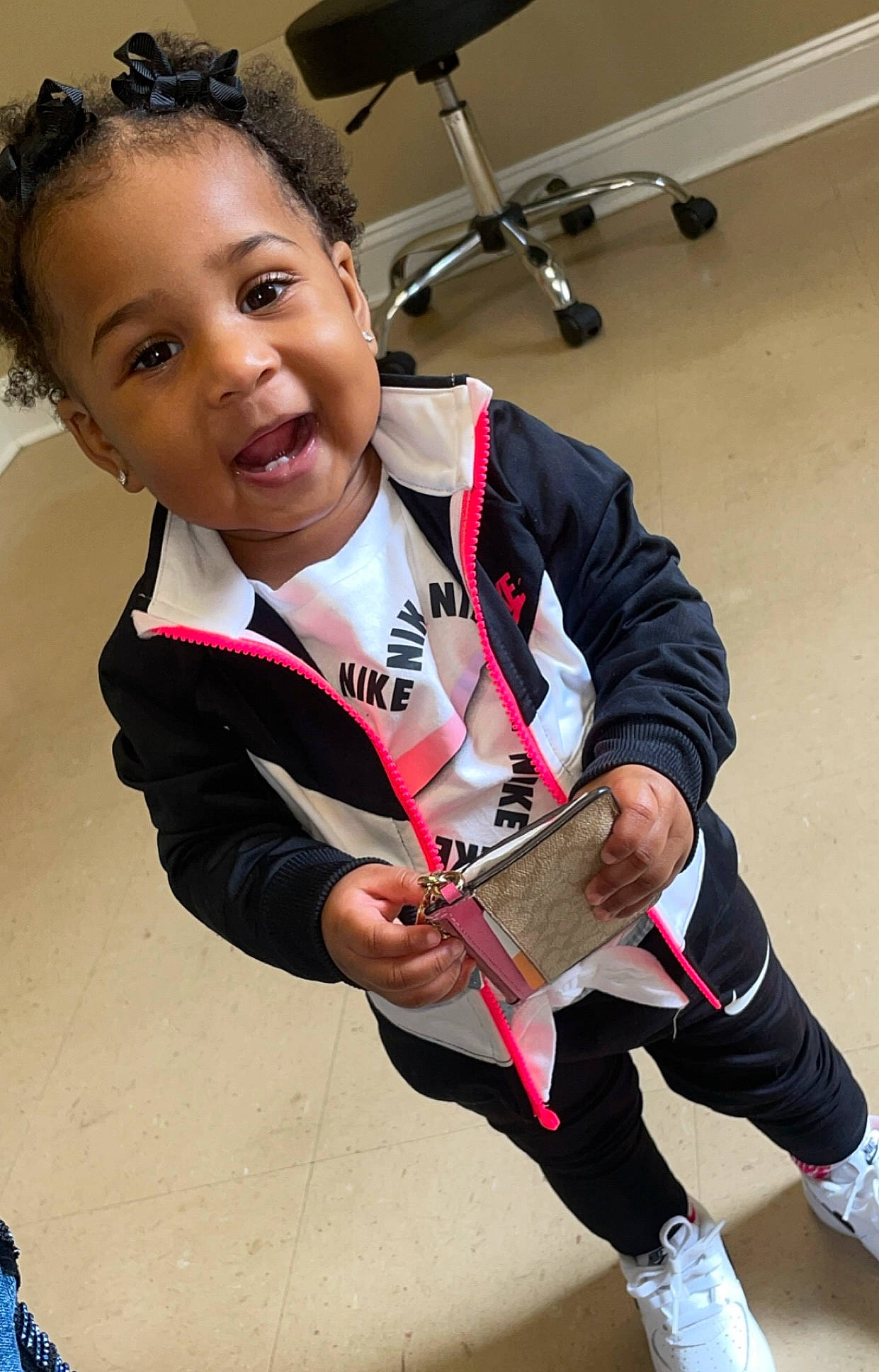 Nyona joined the competition — help win amazing prizes! audio_equipment, championship, child, competition_event, fun, glove, human_leg, musician, person, personal_protective_equipment, player, recreation, running, sitting, sports, sports_gear, sports_uniform, sportswear, t_shirt, tournament