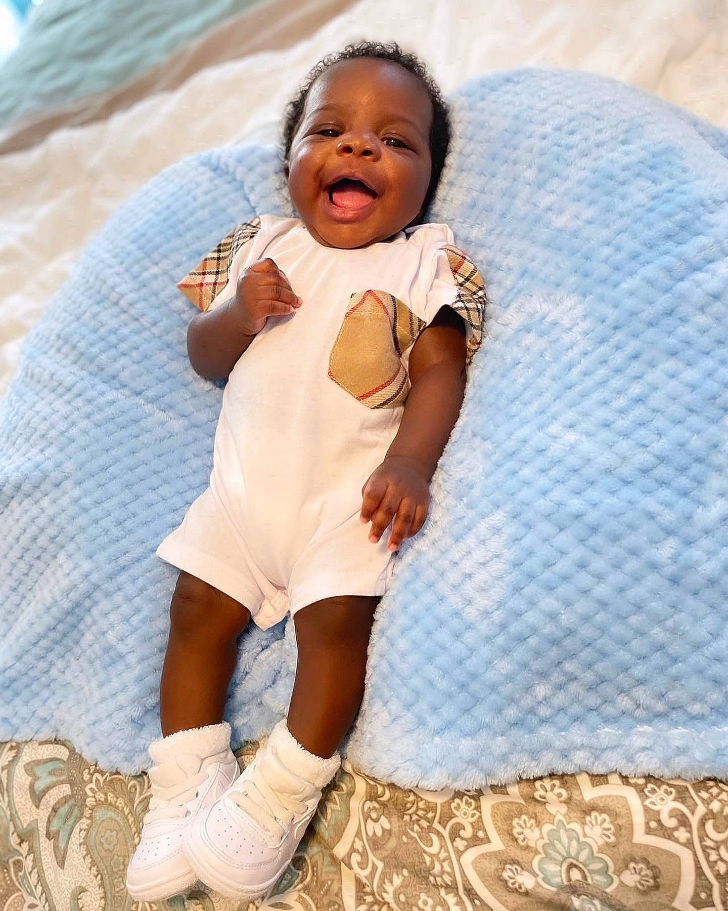 Amiri joined the competition — help win amazing prizes! azure, baby, baby_toddler_clothing, dress, eye, face, happy, head, headgear, human, human_leg, knee, pattern, person, sitting, skin, sleeve, sock, textile, thigh
